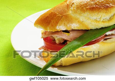 Close-up of a sandwich on a plate View Large Photo Image Stock Photography - Close-up of a sandwich on a plate. Fotosearch