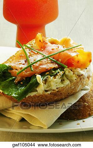 Close-up of a sandwich with a glass of juice View Large Photo Image Picture - Close-up of a sandwich with a glass of juice. Fotosearch