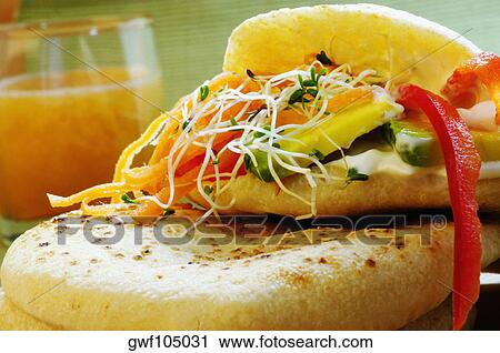 Close-up of a sandwich with a glass of juice View Large Photo Image Stock Image - Close-up of a sandwich with a glass of juice. Fotosearch