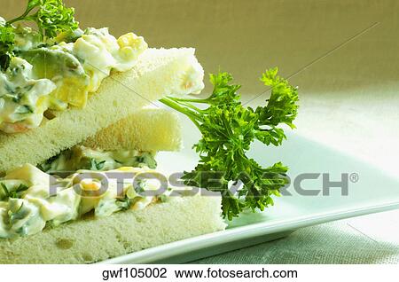 Close-up of a sandwich with cheese on a tray View Large Photo Image Stock Image - Close-up of a sandwich with cheese on a tray. Fotosearch