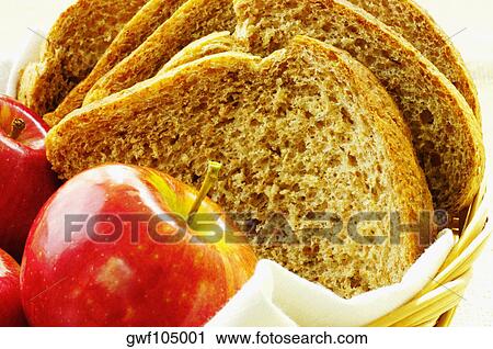 Close-up of apples and brown bread in a basket View Large Photo Image Stock Image - Close-up of apples and brown bread in a basket. Fotosearch