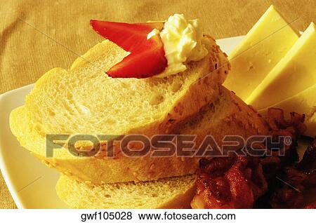 Close-up of bread with cheese on a tray View Large Photo Image Stock Photo - Close-up of bread with cheese on a tray. Fotosearch