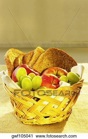 Close-up of fruit and brown bread in a basket View Large Photo Image Stock Image - Close-up of fruit and brown bread in a basket. Fotosearch