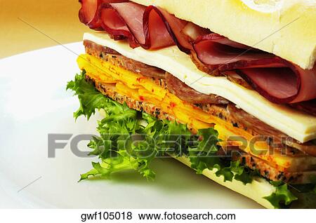 Close-up of roast beef and cheese sandwich on a plate View Large Photo Image Stock Photo - Close-up of roast beef and cheese sandwich on a plate. Fotosearch