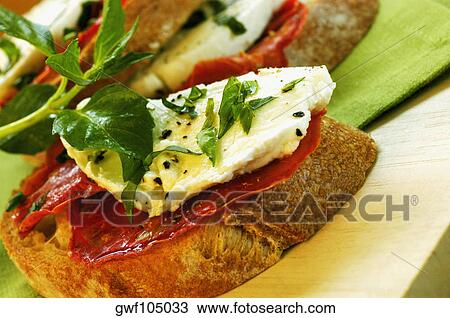 Close-up of sandwiches on a cutting board View Large Photo Image Stock Image - Close-up of sandwiches on a cutting board. Fotosearch