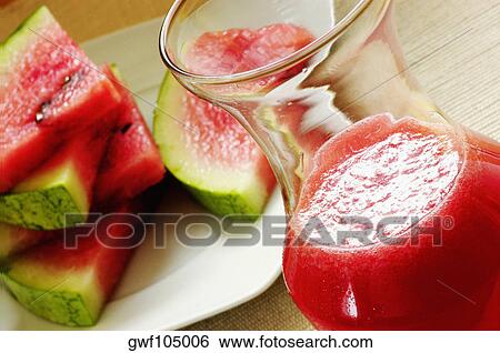 Close-up of slices of watermelon with a glass of juice View Large Photo Image Stock Photograph - Close-up of slices of watermelon with a glass of juice. Fotosearch