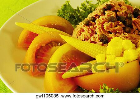 Close-up of tomato slices and baby corn on a plate View Large Photo Image Stock Photography - Close-up of tomato slices and baby corn on a plate. Fotosearch