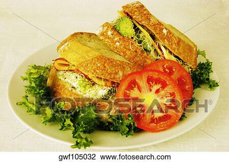Close-up of tomato slices and sandwiches on a plate View Large Photo Image Stock Image - Close-up of tomato slices and sandwiches on a plate. Fotosearch