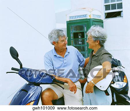 Close-up of a senior couple looking at each other and smiling, Bermuda View Large Photo Image Stock Photo - Close-up of a senior couple looking at each other and smiling, Bermuda. Fotosearch