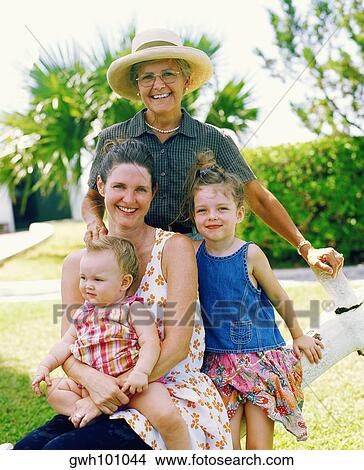 Portrait of a senior woman with her family posing, Bermuda View Large Photo Image Picture - Portrait of a senior woman with her family posing, Bermuda. Fotosearch