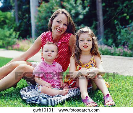 Portrait of a young woman sitting with her two children and smiling, Bermuda View Large Photo Image Stock Image - Portrait of a young woman sitting with her two children and smiling, Bermuda. Fotosearch