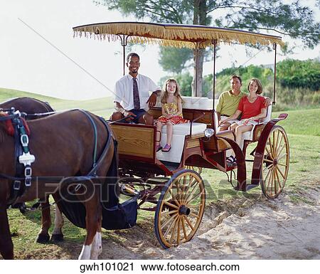 Young couple and their daughter sitting in a carriage, Bermuda View Large Photo Image Stock Image - Young couple and their daughter sitting in a carriage, Bermuda. Fotosearch