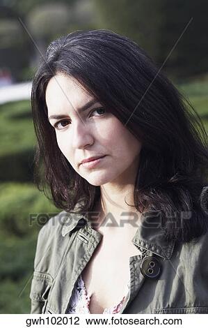 Portrait of a mid adult woman in a garden View Large Photo Image Stock Image - Portrait of a mid adult woman in a garden. Fotosearch
