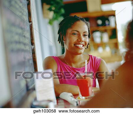 Stock Photo - Close-up of a young woman smiling, Bermuda. Fotosearch