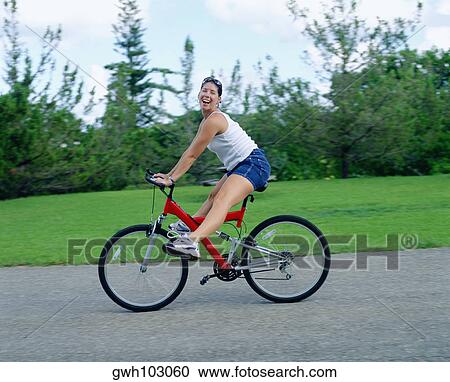 Portrait of a young woman cycling, Bermuda View Large Photo Image Stock Image - Portrait of a young woman cycling, Bermuda. Fotosearch