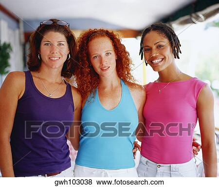 Portrait of three young women standing together, Bermuda View Large Photo Image Stock Photo - Portrait of three young women standing together, Bermuda. Fotosearch