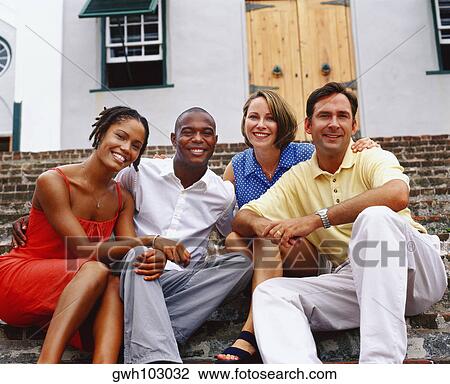 Portrait of two young couples sitting on steps and smiling, Bermuda View Large Photo Image Stock Image - Portrait of two young couples sitting on steps and smiling, Bermuda. Fotosearch