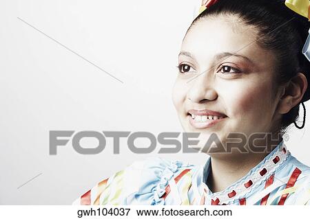 Close-up of a teenage girl smiling View Large Photo Image Stock Photo - Close-up of a teenage girl smiling. Fotosearch