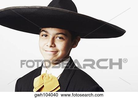 Stock Image - Portrait of a teenage boy in traditional clothing. Fotosearch