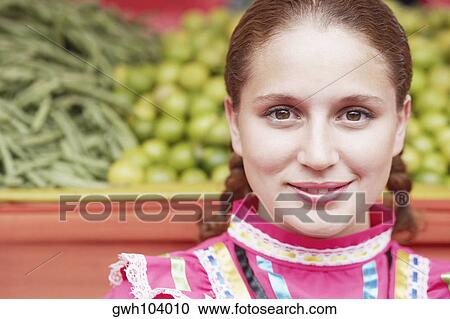 Portrait of a young woman smiling View Large Photo Image Stock Image - Portrait of a young woman smiling. Fotosearch