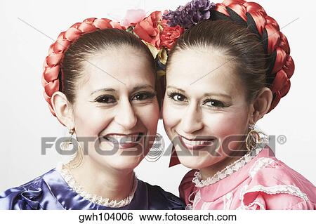 Stock Photograph - Portrait of two young women smiling. Fotosearch