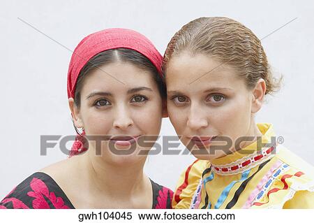 Portrait of two young women smiling together View Large Photo Image Stock Photography - Portrait of two young women smiling together. Fotosearch