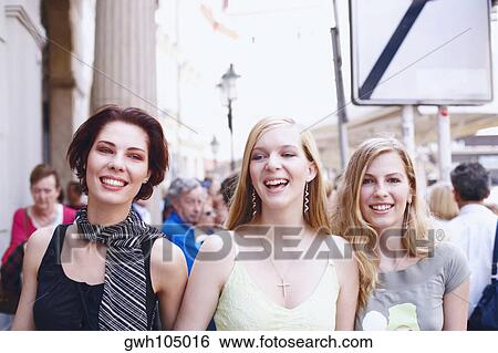 Portrait of three young women smiling View Large Photo Image Stock Photograph - Portrait of three young women smiling . Fotosearch