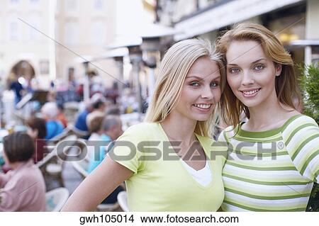 Portrait of two young women smiling View Large Photo Image Picture - Portrait of two young women smiling . Fotosearch