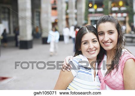 Portrait of two young women smiling View Large Photo Image Stock Image - Portrait of two young women smiling. Fotosearch