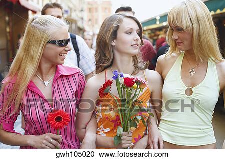Two young women and a teenage girl smiling View Large Photo Image Stock Image - Two young women and a teenage girl smiling . Fotosearch