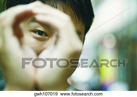 Close-up of a mid adult man gesturing with his hands View Large Photo Image Stock Photo - Close-up of a mid adult man gesturing with his hands. Fotosearch