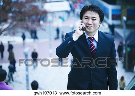 Portrait of a businessman man talking on a mobile phone View Large Photo Image Stock Image - Portrait of a businessman man talking on a mobile phone . Fotosearch
