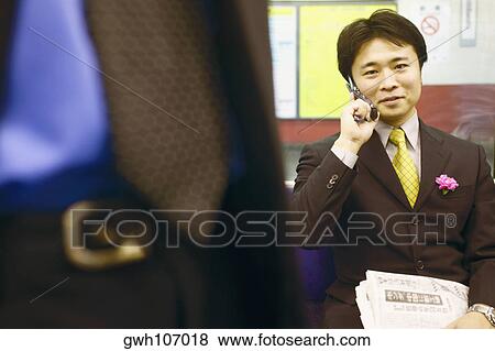 Portrait of a businessman talking on a mobile phone View Large Photo Image Stock Photo - Portrait of a businessman talking on a mobile phone . Fotosearch