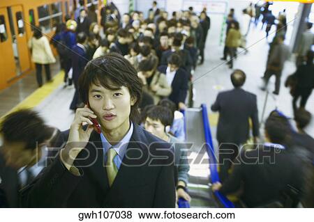 Portrait of a businessman talking on a mobile phone View Large Photo Image Stock Photo - Portrait of a businessman talking on a mobile phone . Fotosearch