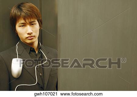 Portrait of a young man with a computer mouse around his neck View Large Photo Image Stock Image - Portrait of a young man with a computer mouse around his neck. Fotosearch