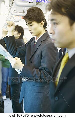 Side profile of a businessman traveling in a train View Large Photo Image Stock Photography - Side profile of a businessman traveling in a train . Fotosearch