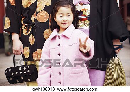 Stock Image - Portrait of a girl smiling . Fotosearch