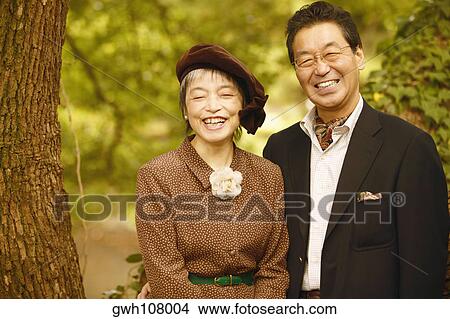 Portrait of a senior man and a mature woman smiling View Large Photo Image Picture - Portrait of a senior man and a mature woman smiling . Fotosearch