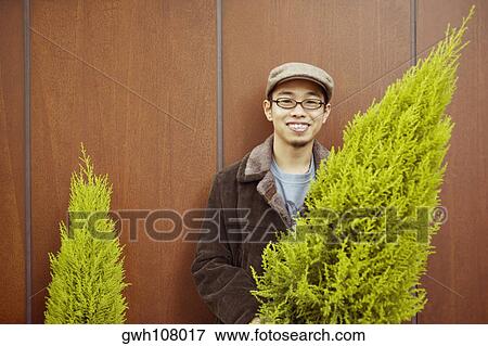 Stock Photo - Portrait of a young man smiling. Fotosearch