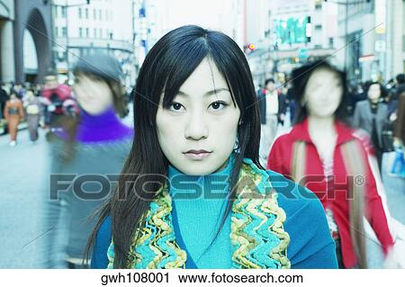 Portrait of a young woman at the market View Large Photo Image Stock Image - Portrait of a young woman at the market . Fotosearch