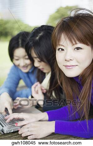 Stock Photography - Portrait of a young woman smiling . Fotosearch