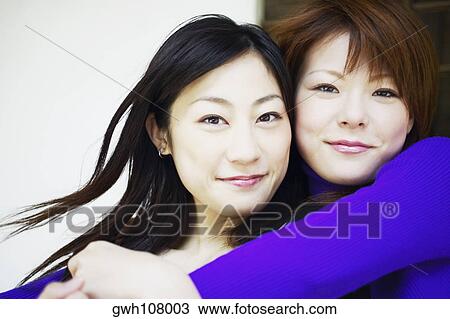 Portrait of two young women smiling View Large Photo Image Stock Image - Portrait of two young women smiling. Fotosearch
