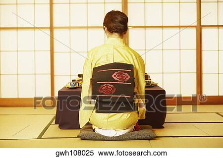Rear view of a young woman wearing a Kimono View Large Photo Image Stock Photography - Rear view of a young woman wearing a Kimono . Fotosearch