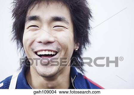 Picture - Close-up of a mid adult man laughing. Fotosearch