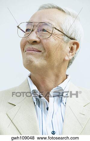 Close-up of a senior man smiling View Large Photo Image Stock Photo - Close-up of a senior man smiling. Fotosearch