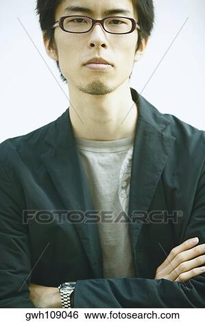 Portrait of a mid adult man with his arms folded View Large Photo Image Stock Photograph - Portrait of a mid adult man with his arms folded. Fotosearch