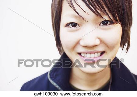Portrait of a young woman smiling View Large Photo Image Stock Image - Portrait of a young woman smiling. Fotosearch