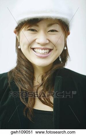Portrait of a young woman smiling View Large Photo Image Stock Image - Portrait of a young woman smiling. Fotosearch