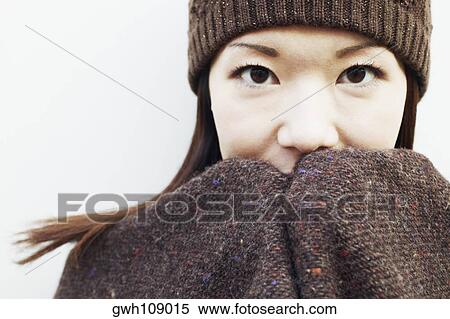 Stock Photography - Portrait of a young woman wearing a knitted hat. Fotosearch