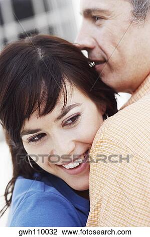 Close-up of a mature man and a young woman View Large Photo Image Stock Image - Close-up of a mature man and a young woman. Fotosearch